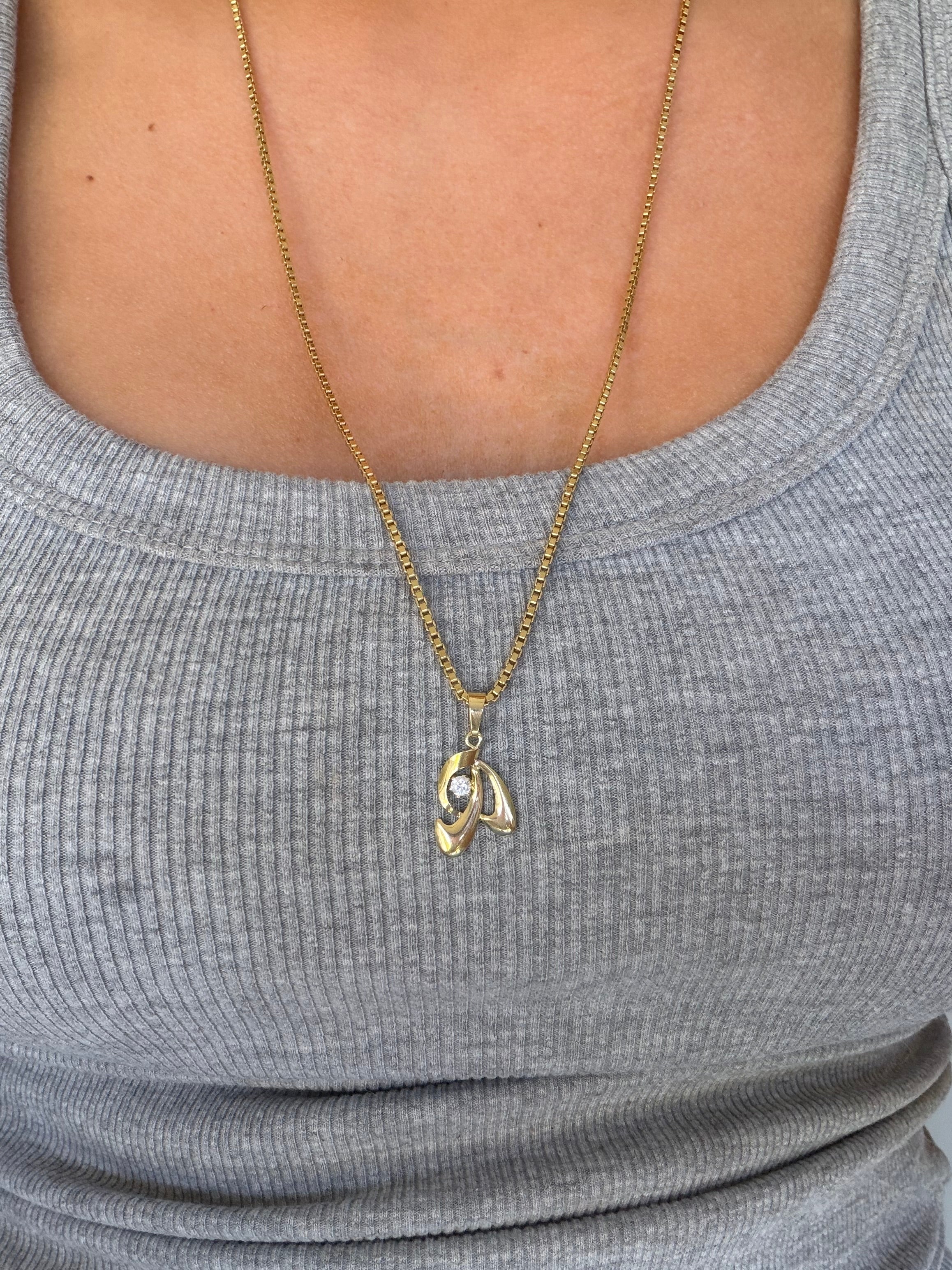14 karat gold pendant with zirconia