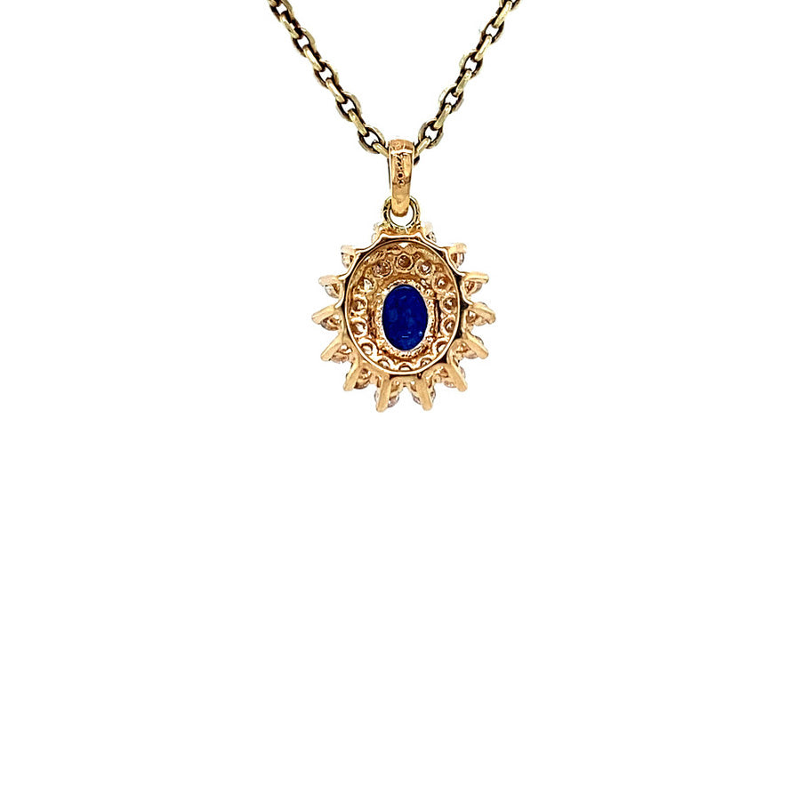 Gold entourage pendant with diamond and sapphire 14 karat* New