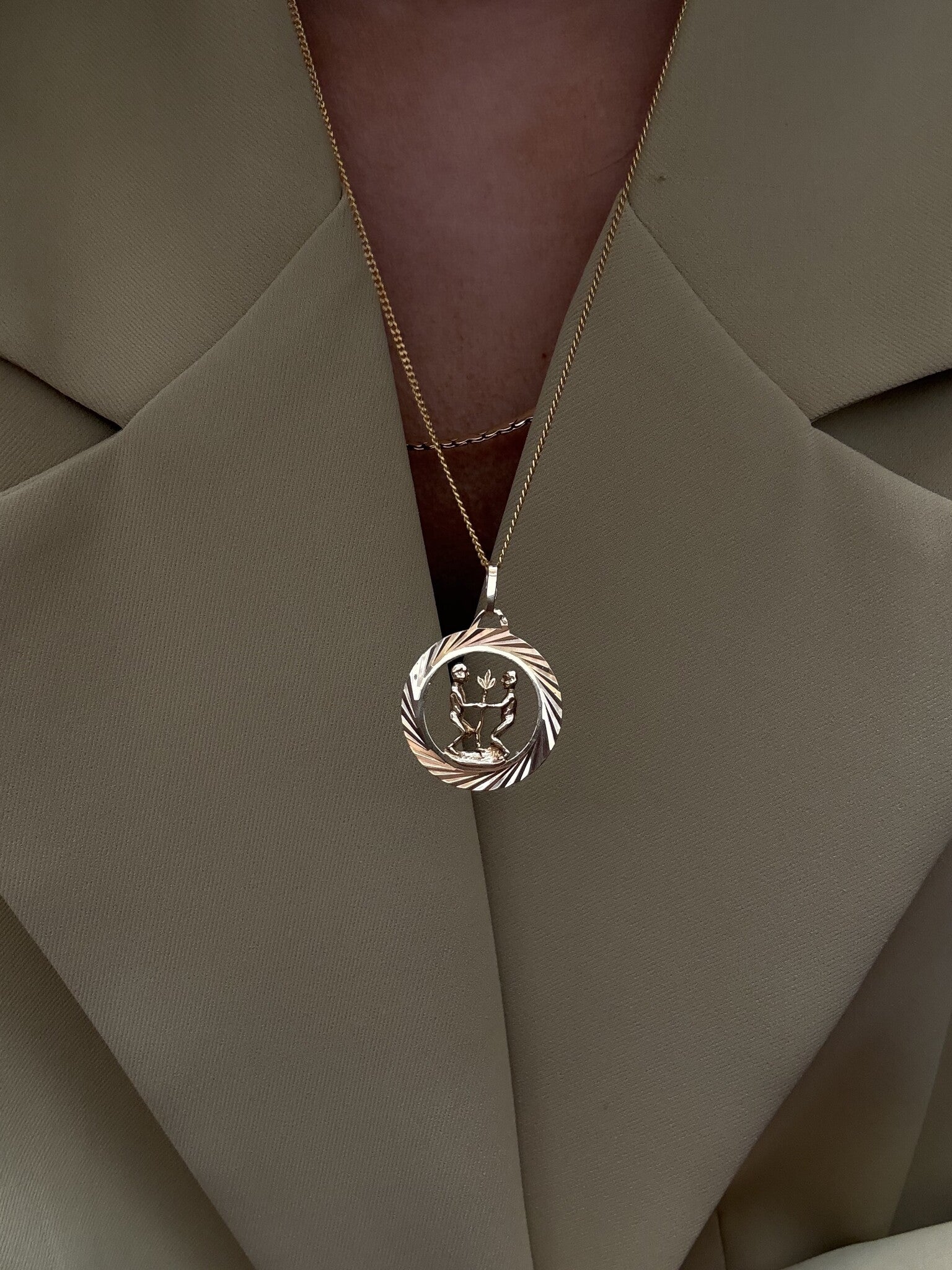 Golden zodiac pendant Gemini 14 karat