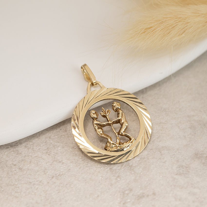 Golden zodiac pendant Gemini 14 karat