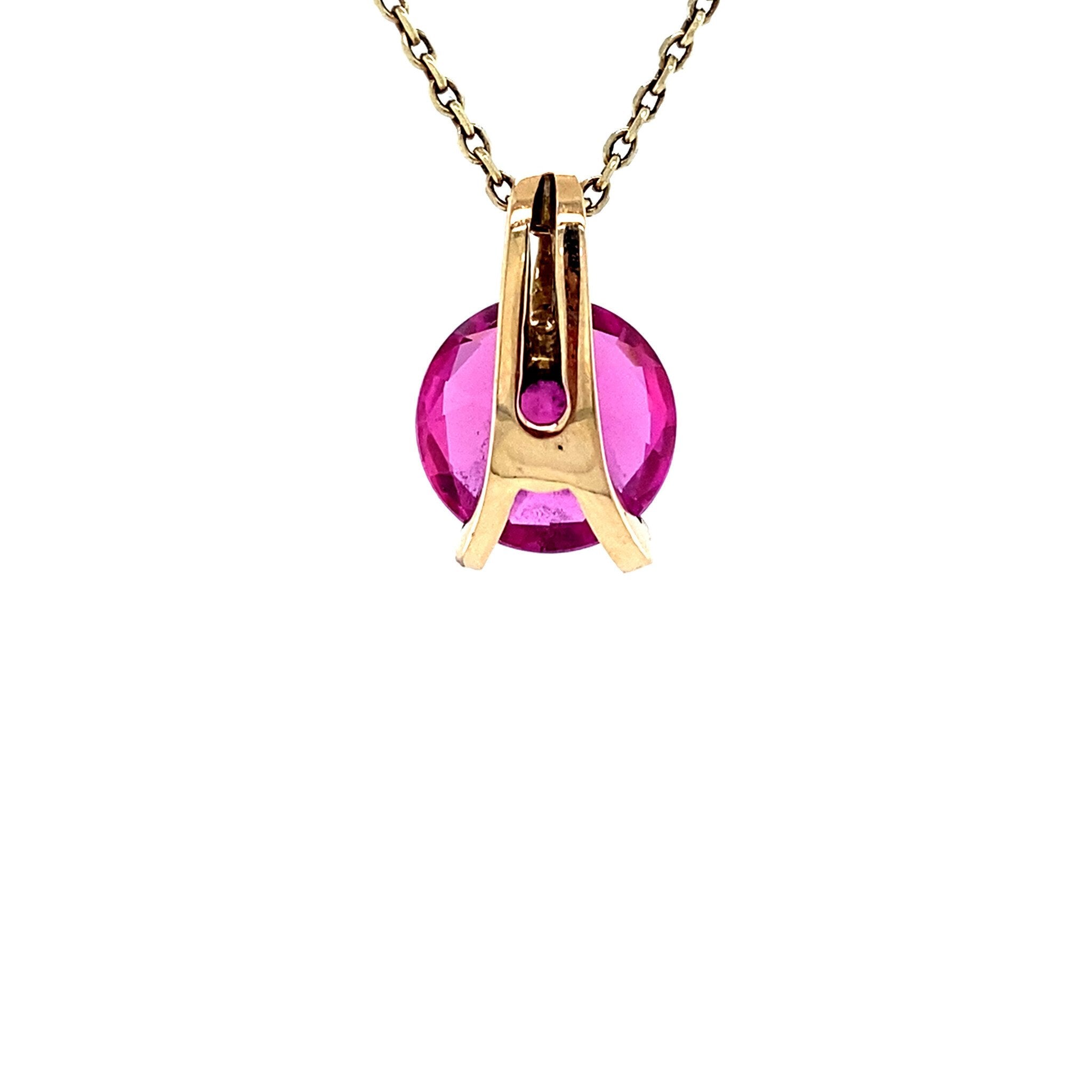 14 karat gold pendant with pink gemstone