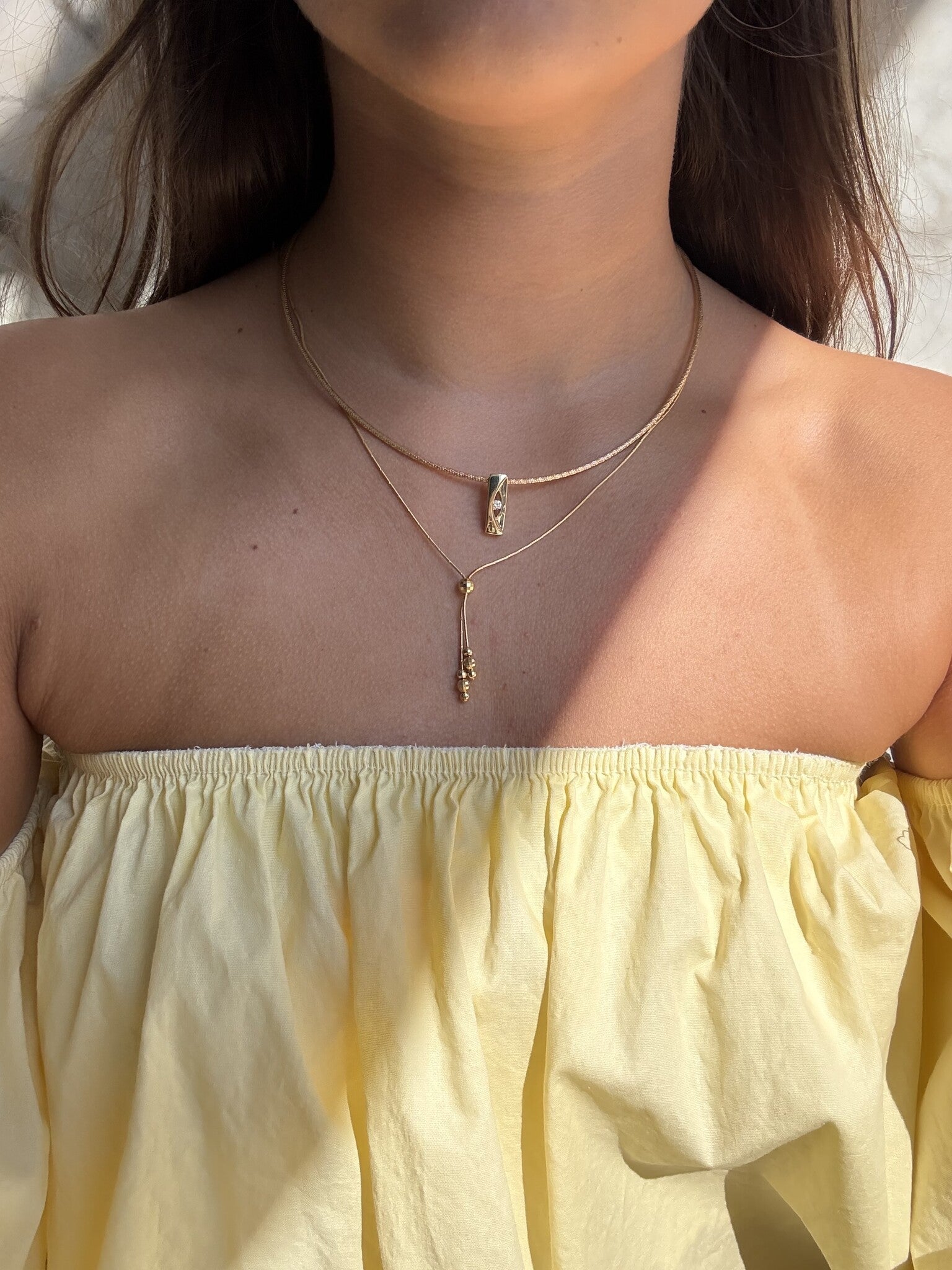 Gold bangle with diamond pendant 14 karat