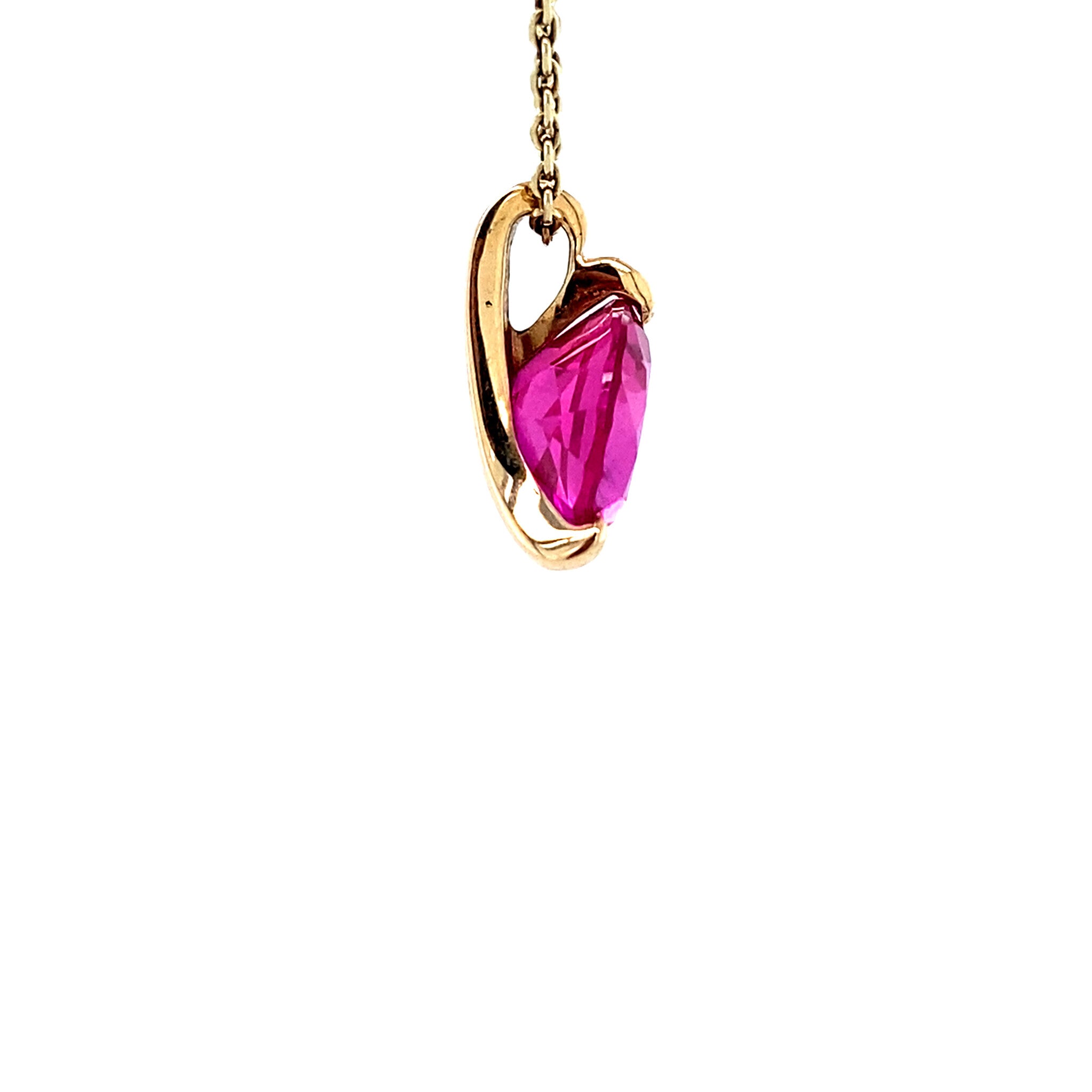 14 karat gold pendant with pink gemstone