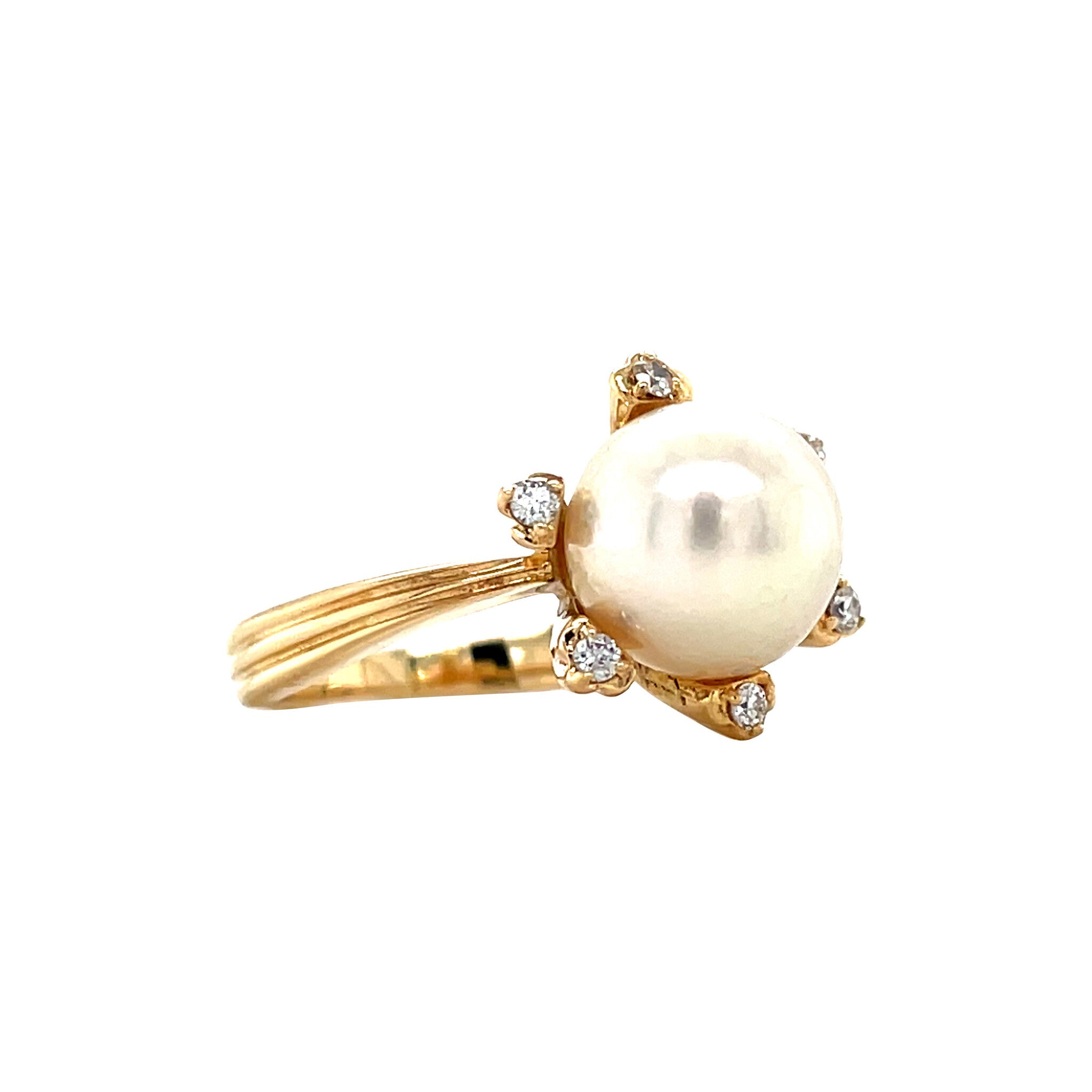 Gold entourage ring with pearl and diamond 18 karat