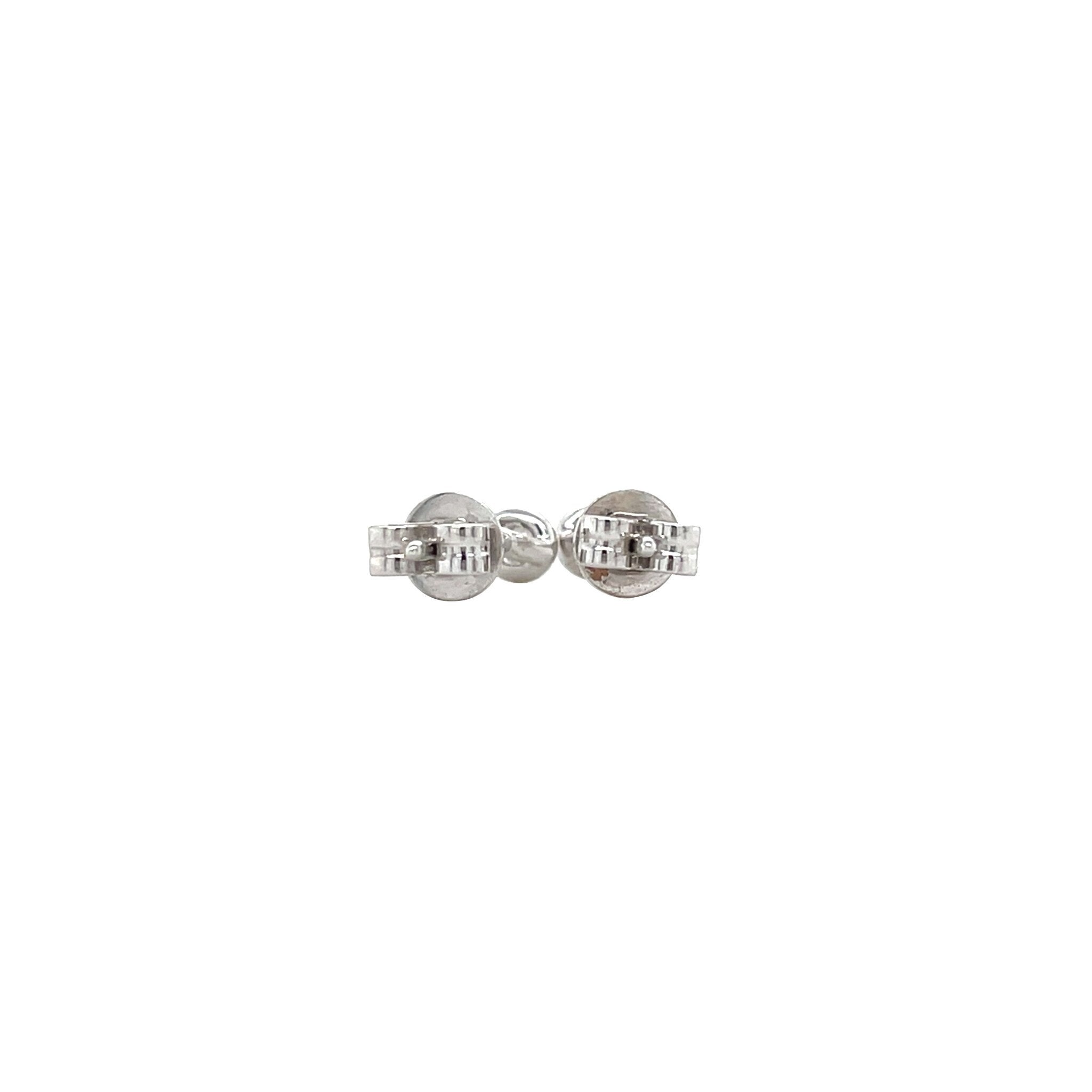 White gold solitaire stud earrings 14 kt
