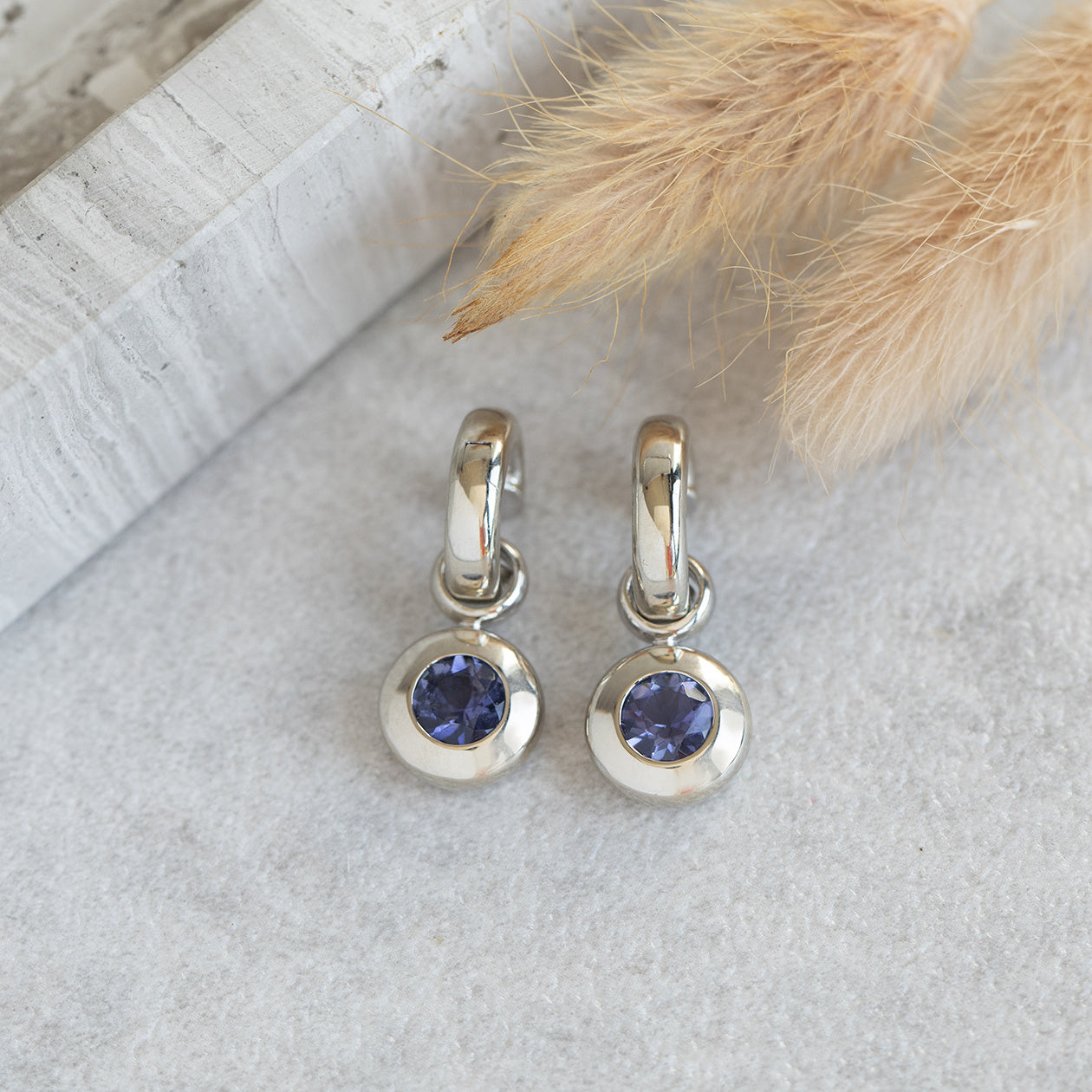 White gold hinged hoop earrings with iolite from Bron Jewelry 14 kt