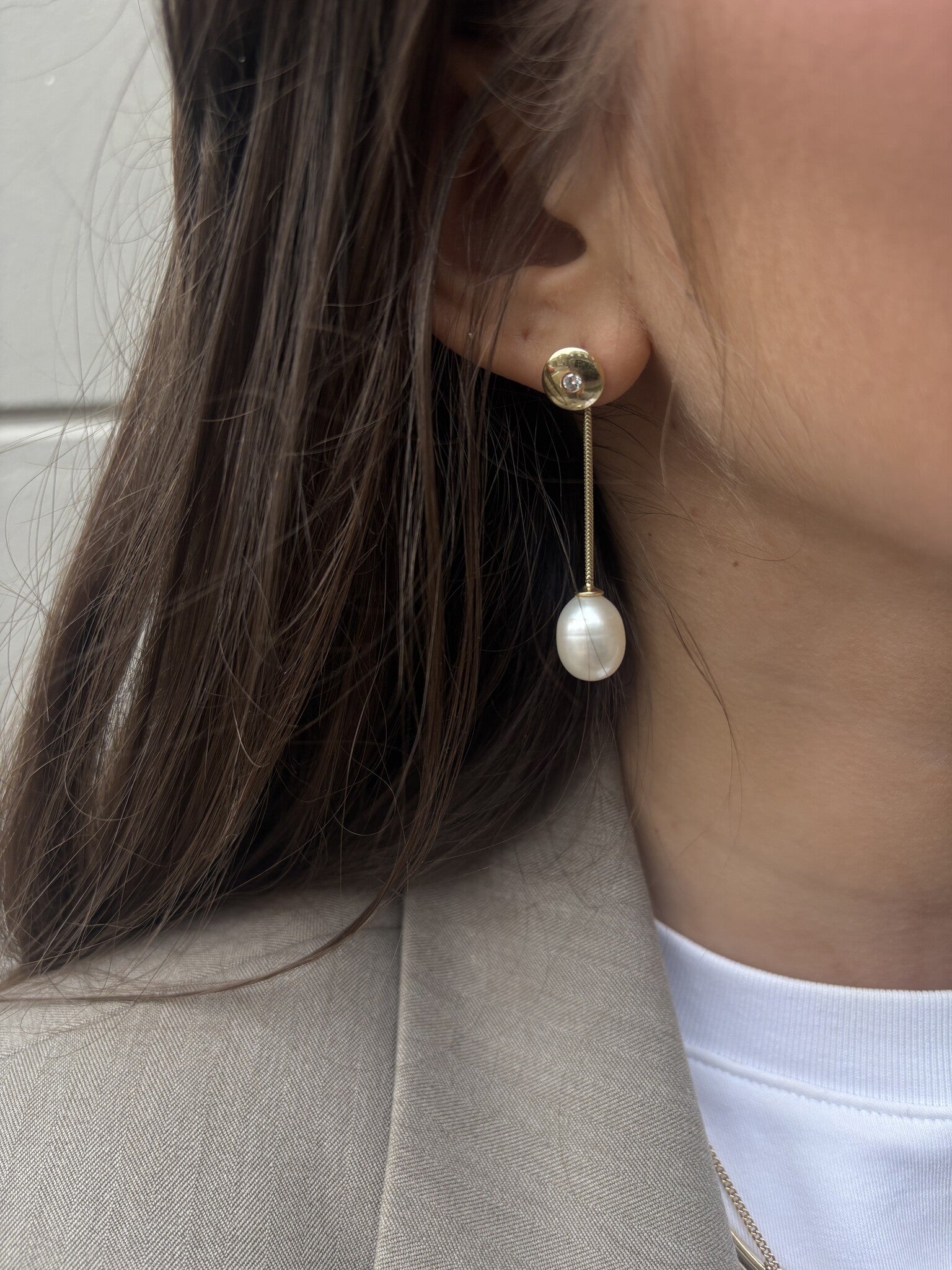 Gold stud earrings with diamond and pearl 14 karat