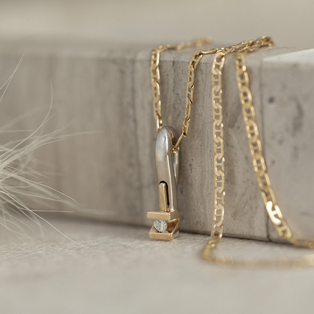 White gold pendant with diamond in 14 karat yellow gold