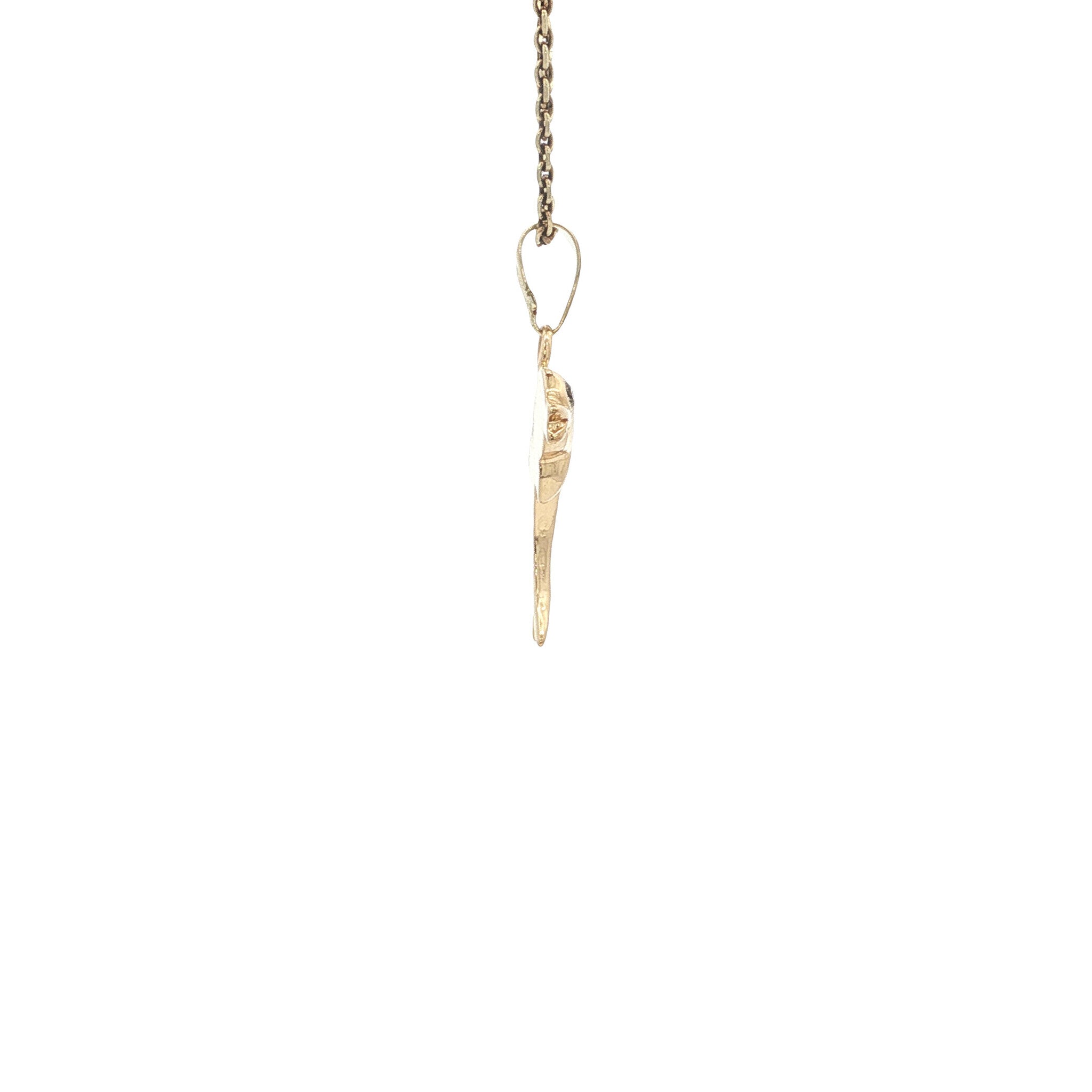 Gold dolphin pendant with 14 karat diamond