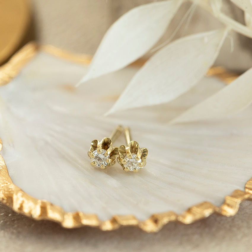 14-karat gold solitaire diamond stud earrings