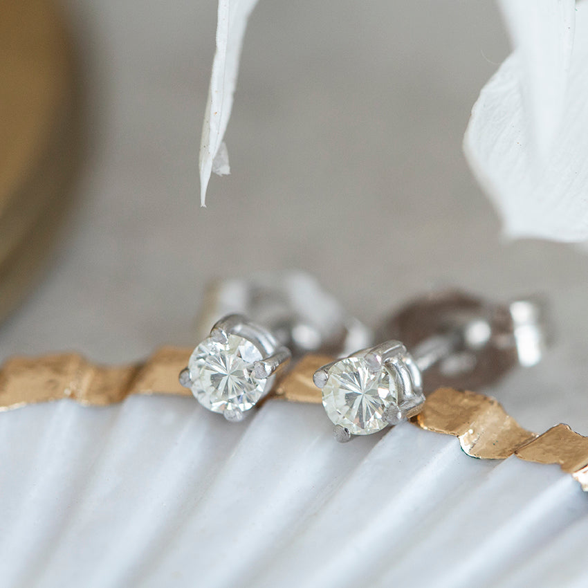 14-karat white gold solitaire diamond stud earrings — new