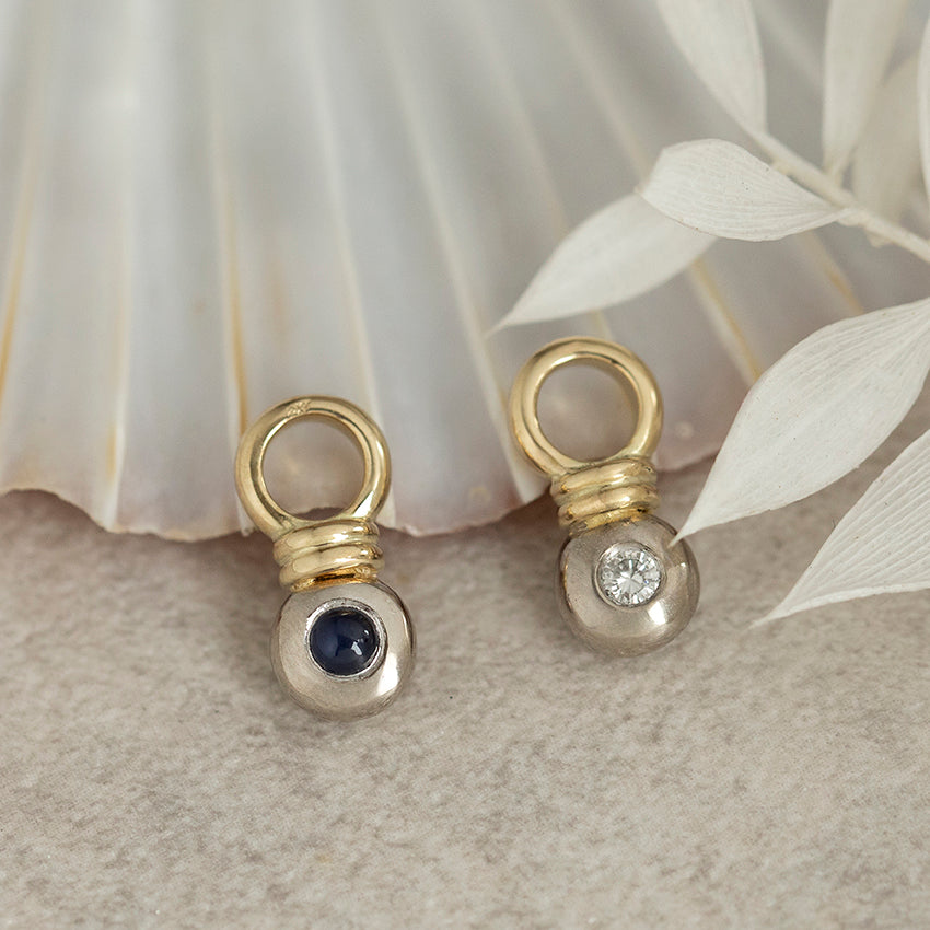 14-karat gold pendants with sapphire and diamond