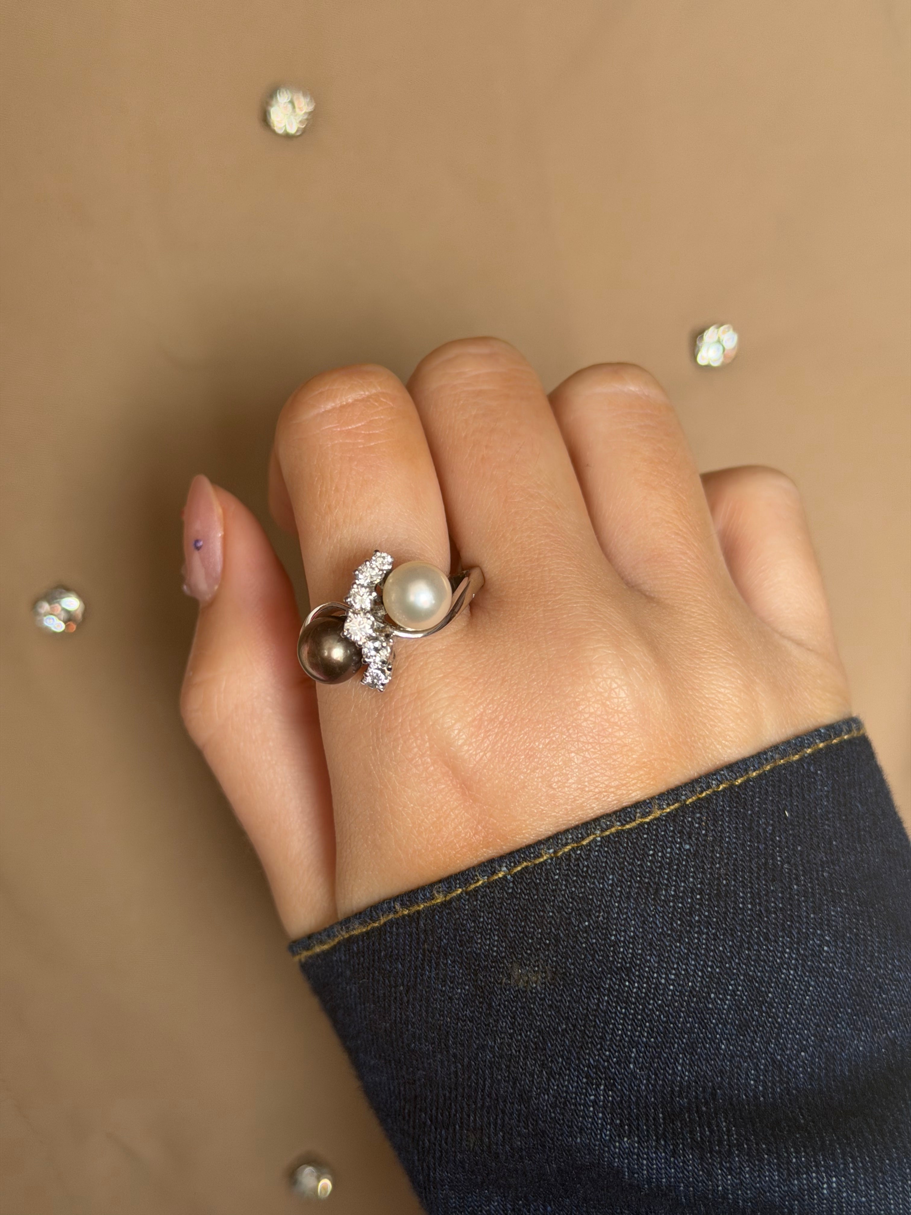 14-karat white gold ring with a diamond and pearls