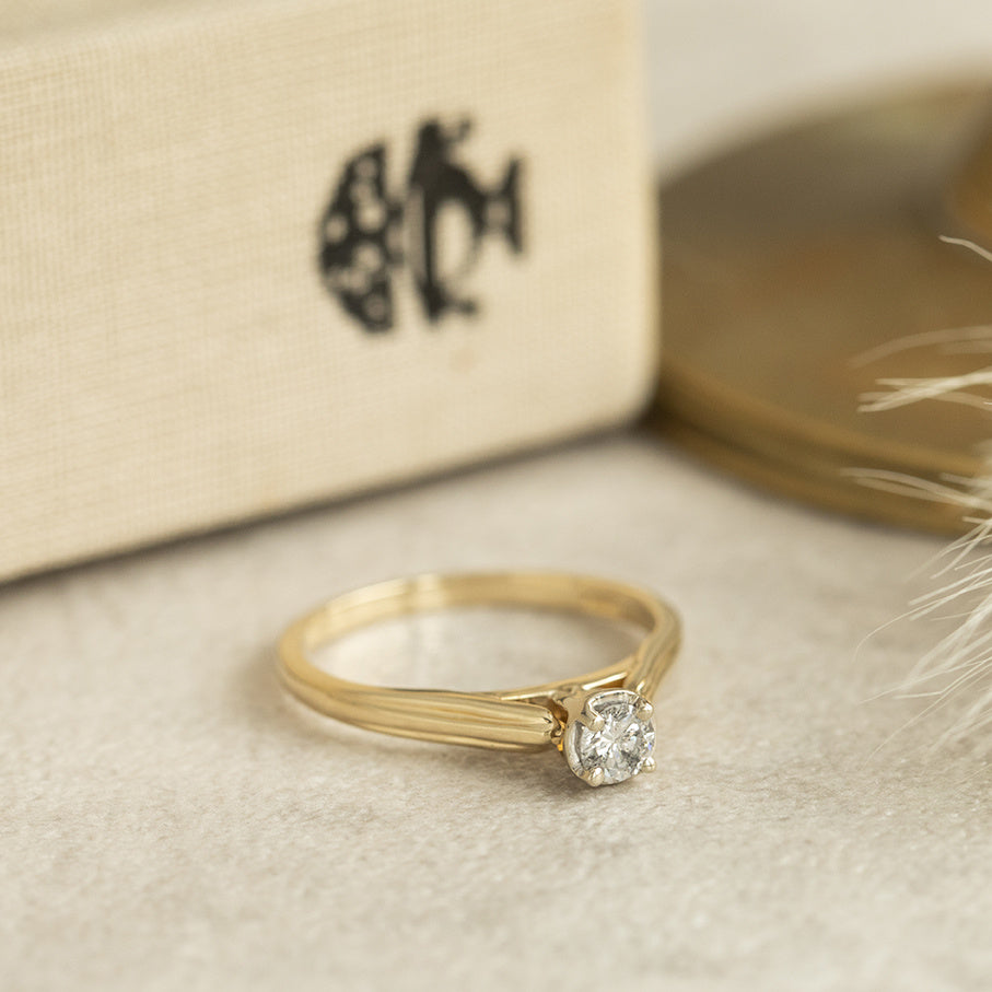Golden solitaire ring with diamond 14 karat