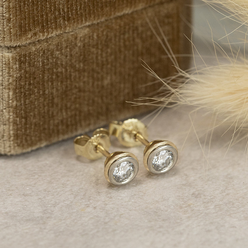 Gold solitaire stud earrings with diamond 14 karat