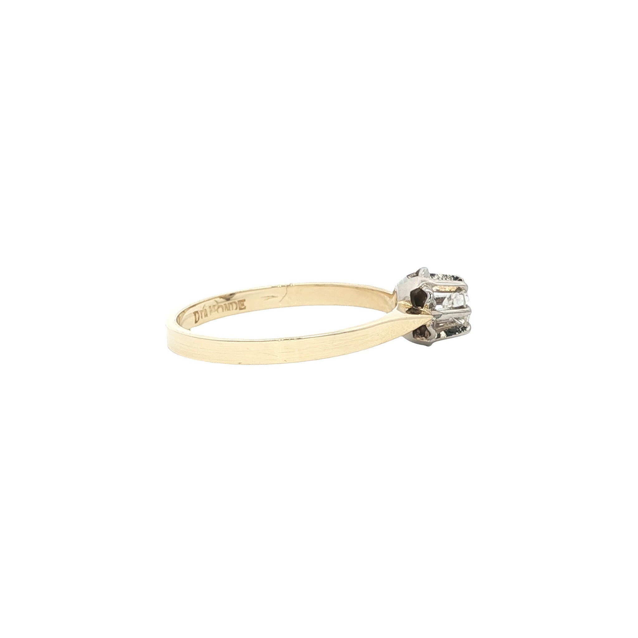 14 karat gold solitaire ring with a diamond