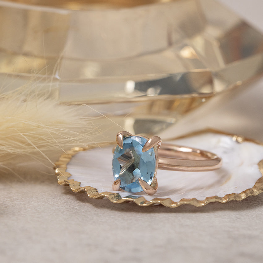 Rose gold ring with topaz 14 karat