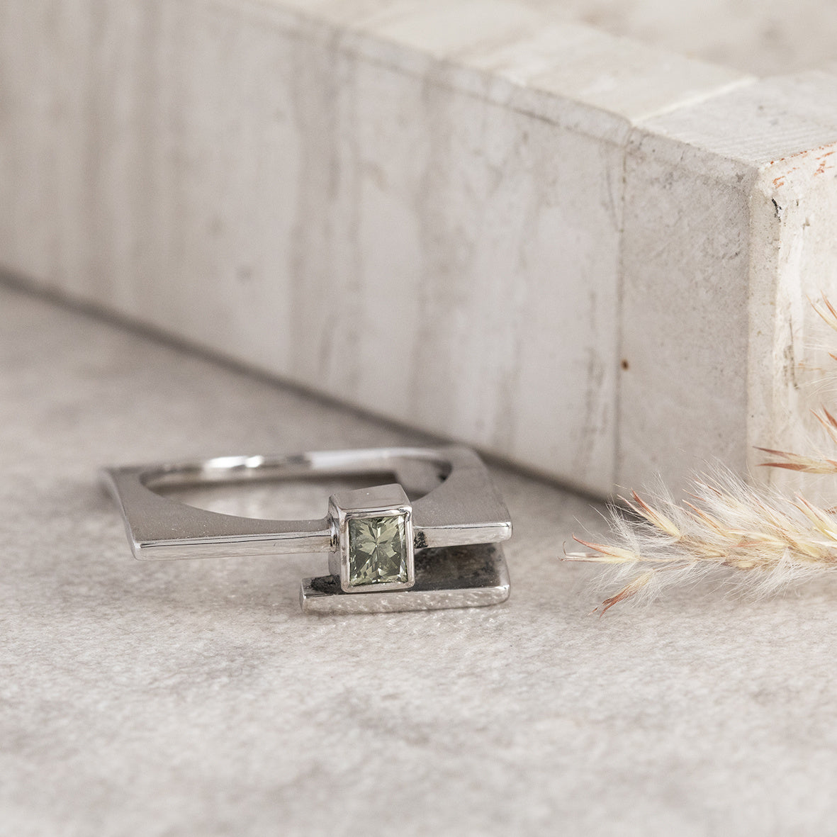 White gold design ring with green diamond 14 karat