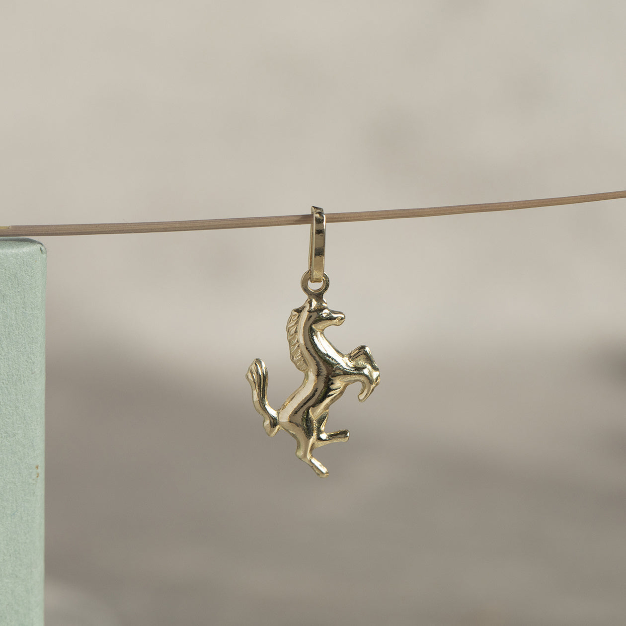 Gold horse pendant 14 kt