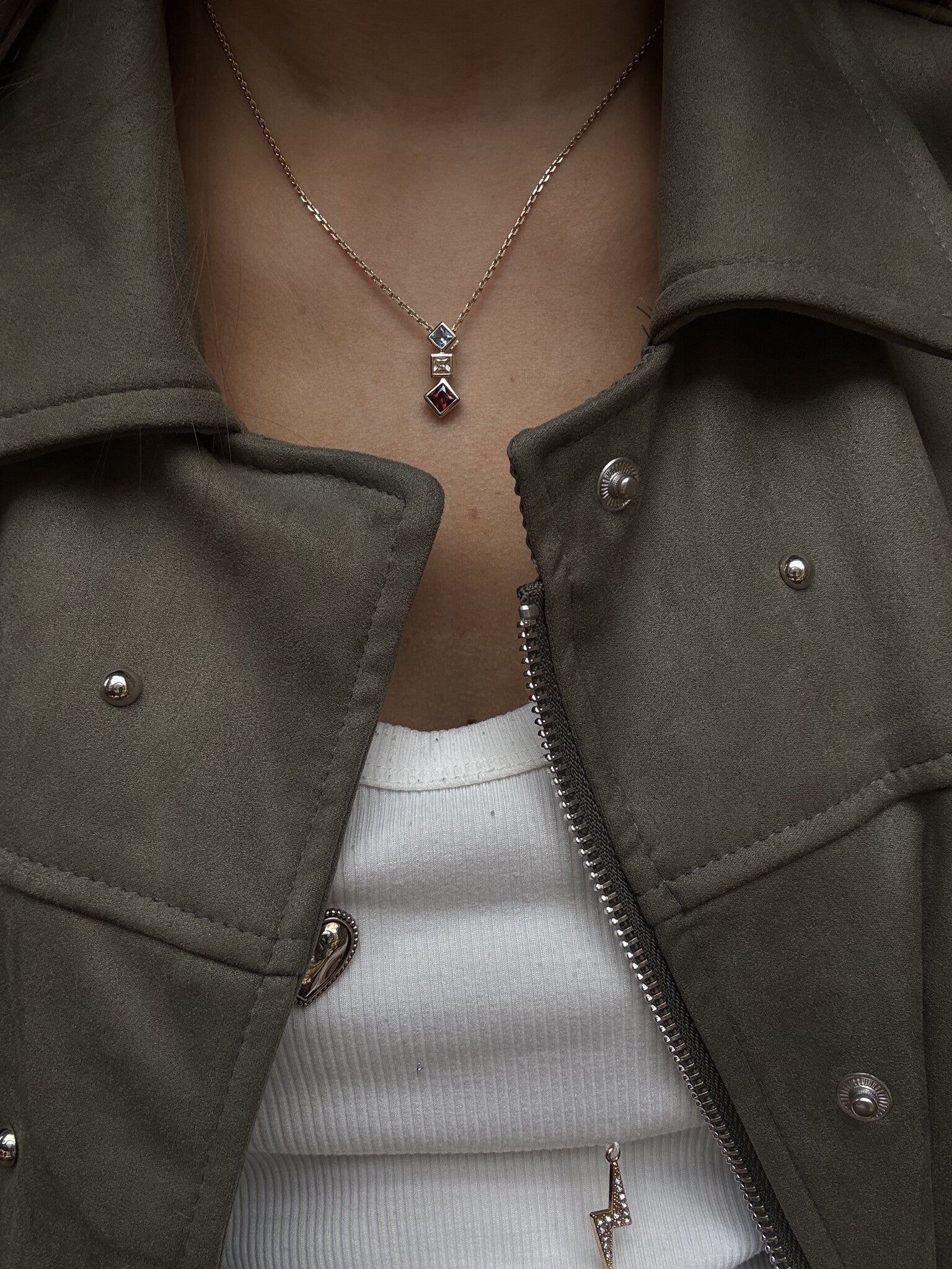 14 karat gold pendant with colored stone