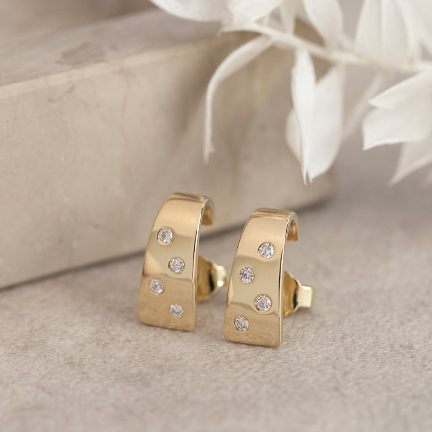 14 karat gold diamond stud earrings